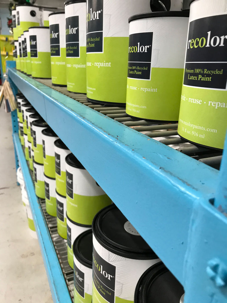 Close up of RECOLOR® cans of shelves